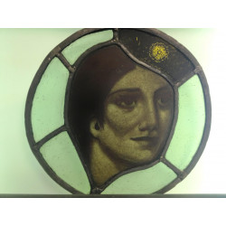 Painted stained glass roundel of womans head