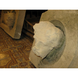 A pair of sandstone heads